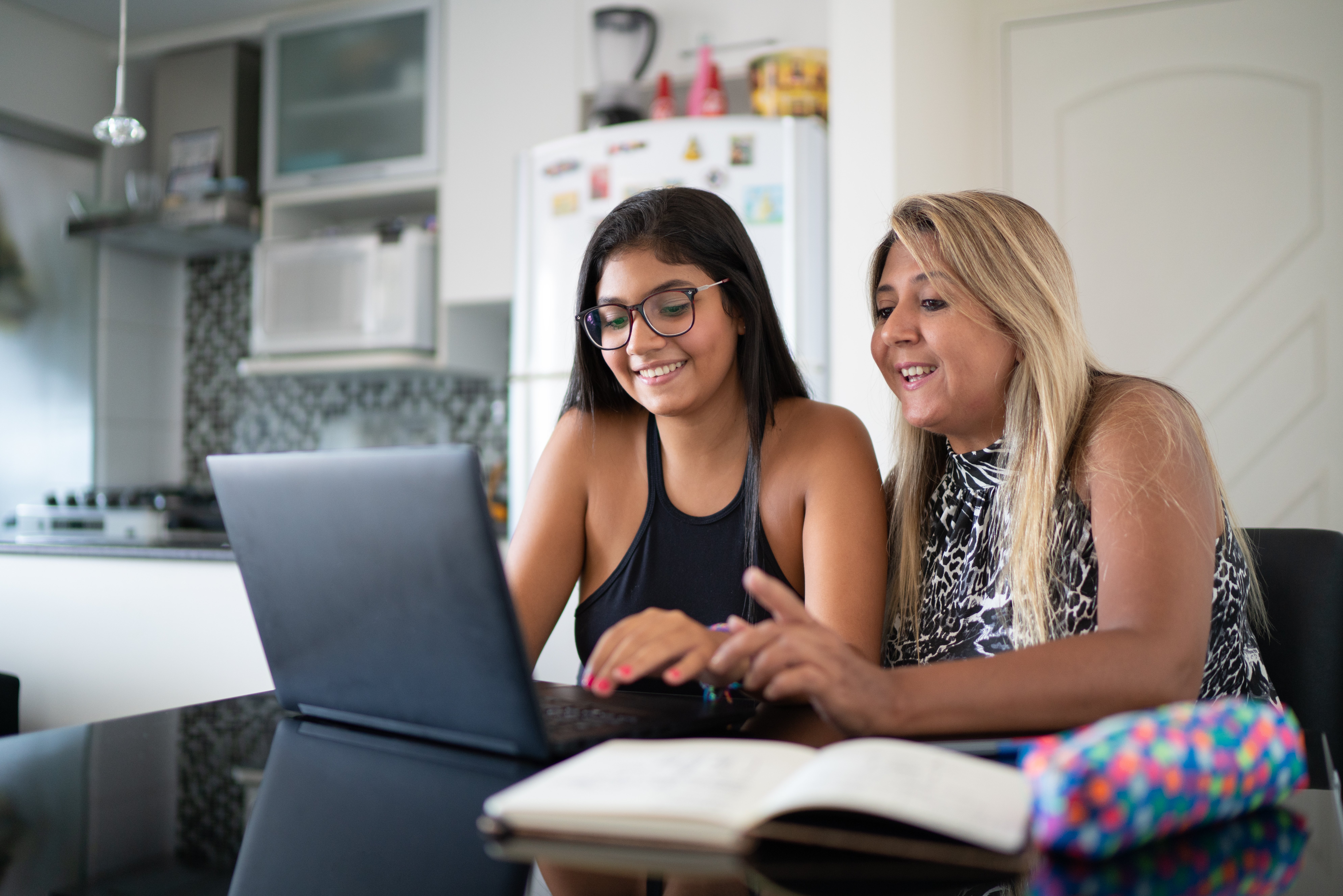 Hispanic mom and teen doing online virtual therapy Hispanic mom and teen doing online virtual therapy